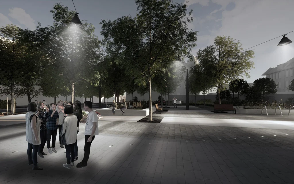 Wizualizacja deptaka wieczorem — grupa osób rozmawiająca pod wiszącymi lampami na linach, oświetlone betonowe siedziska i ławki wśród drzew.