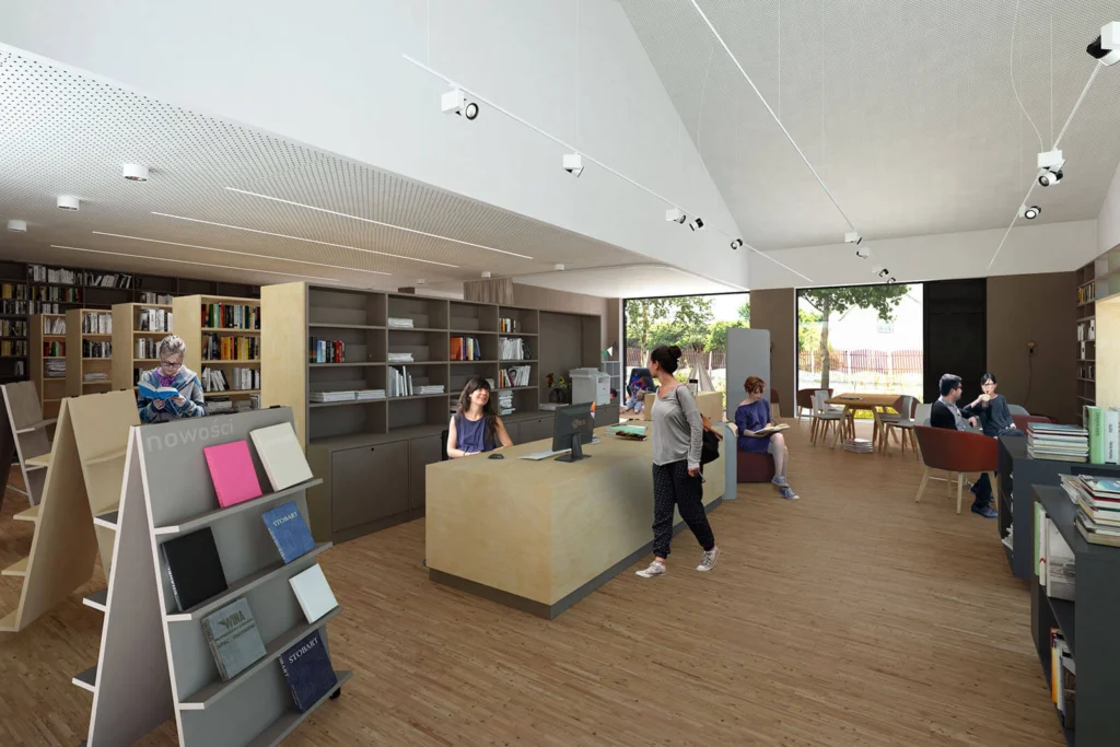 Strefa biblioteki z wystawką nowości, ladą biblioteczną, czytelnikami przeglądającymi książki i stolikami do rozmów przy dużych oknach.
